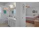 Ensuite bath featuring dual vanity and view to the main bedroom at 5357 Kirkwood Ave, Spring Hill, FL 34608