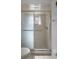 Neutral colored bathroom with tiled walk-in shower at 5357 Kirkwood Ave, Spring Hill, FL 34608