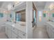 Bright bathroom featuring double sinks and tiled shower at 5357 Kirkwood Ave, Spring Hill, FL 34608