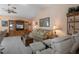 Comfortable living room features built-in shelving, a plush sofa, and relaxing recliner chairs at 5357 Kirkwood Ave, Spring Hill, FL 34608