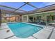 Beautiful screened-in pool with patio and ample seating, perfect for relaxation and entertainment at 5357 Kirkwood Ave, Spring Hill, FL 34608