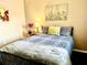 Relaxing bedroom featuring comfortable bedding and stylish decor at 6916 Stonesthrow N Cir # 9103, St Petersburg, FL 33710