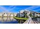Beautiful multi-story condo building with well-manicured landscaping and serene waterfront views at 6916 Stonesthrow N Cir # 9103, St Petersburg, FL 33710