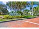 Stone's Throw Condominiums sign at the entrance with manicured landscaping at 6916 Stonesthrow N Cir # 9103, St Petersburg, FL 33710