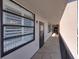 View of the exterior hallway, highlighting the building's architecture and accessible entryways to each unit at 7600 Sun Island S Dr # 703, South Pasadena, FL 33707