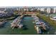 Aerial view of a harbor with boats docked and condos in the background at 7902 Sailboat Key S Blvd # 206, South Pasadena, FL 33707