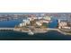 Aerial view of waterfront condominiums, a bridge, and boat docks along the tranquil bay at 7902 Sailboat Key S Blvd # 206, South Pasadena, FL 33707