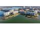 Aerial view of waterfront condos, showcasing the building's amenities, including a pool, landscaping and water access at 7902 Sailboat Key S Blvd # 206, South Pasadena, FL 33707