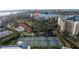 Scenic aerial view of community amenities: tennis courts and sparkling pool at 7902 Sailboat Key S Blvd # 206, South Pasadena, FL 33707