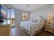 Bedroom showcases waterfront views, balcony access, and a comfortable queen size bed at 7902 Sailboat Key S Blvd # 206, South Pasadena, FL 33707