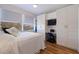 Comfortable bedroom features built-in cabinets, a desk, and a large window at 7902 Sailboat Key S Blvd # 206, South Pasadena, FL 33707