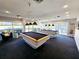 Bright game room with two pool tables and large windows that offer a scenic view at 7902 Sailboat Key S Blvd # 206, South Pasadena, FL 33707
