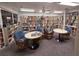 Cozy library features bookshelves filled with books and comfortable seating areas with tables at 7902 Sailboat Key S Blvd # 206, South Pasadena, FL 33707