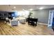 Spacious living room with a grand piano, modern decor and plenty of seating at 7902 Sailboat Key S Blvd # 206, South Pasadena, FL 33707