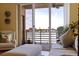 Cozy living room with balcony access, comfortable seating, and serene water views at 7902 Sailboat Key S Blvd # 206, South Pasadena, FL 33707