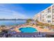 Waterfront condo community pool with lounge chairs and covered seating area at 7902 Sailboat Key S Blvd # 206, South Pasadena, FL 33707