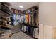 Spacious walk-in closet features custom shelving for ample storage and patterned tile flooring at 7902 Sailboat Key S Blvd # 206, South Pasadena, FL 33707