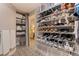 Organized walk-in closet with custom shelving and storage, offering ample space for shoes and accessories at 7902 Sailboat Key S Blvd # 206, South Pasadena, FL 33707