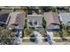 Bird's-eye view of the home showcases landscaping, driveway, and proximity to neighboring properties in the community at 814 15Th Ne St, Ruskin, FL 33570