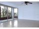 Bright living room featuring tile floors, a ceiling fan, and sliding glass doors opening to the outdoor patio at 8632 Tahoe Ct # 6, Tampa, FL 33614