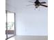 Bright living room featuring tile floors, a ceiling fan, and sliding glass doors opening to the outdoor patio at 8632 Tahoe Ct # 6, Tampa, FL 33614