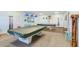 Game room with two pool tables and plenty of space for billiards enthusiasts at 9 Forbes Pl # 206, Dunedin, FL 34698