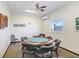 Cozy game room with a poker table and comfortable seating for friendly gatherings at 9 Forbes Pl # 206, Dunedin, FL 34698