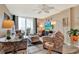 Bright and inviting living room with comfortable seating, stylish decor, and plenty of natural light at 9 Forbes Pl # 206, Dunedin, FL 34698