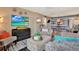 Comfortable living room with ample seating, bright decor, and tv perfect for relaxation and entertainment at 9 Forbes Pl # 206, Dunedin, FL 34698