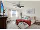 Bright bedroom features a comfortable bed, bright windows, and cozy decor at 9 Forbes Pl # 206, Dunedin, FL 34698