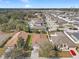 An aerial view showcases a beautiful residential neighborhood with well-maintained houses and green spaces at 13339 Mandalay Pl, Spring Hill, FL 34609