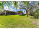 Spacious backyard with lush greenery, perfect for outdoor activities and enjoying nature at 15944 Ternglade Dr, Lithia, FL 33547
