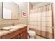 Neutral bathroom with a vanity, toilet, and shower-tub combo at 15944 Ternglade Dr, Lithia, FL 33547