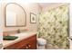 Neutral bathroom features vanity, toilet, and shower with leafy curtain at 15944 Ternglade Dr, Lithia, FL 33547