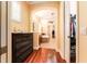 Bathroom with wood floors, an arched entry, dual sinks, a soaking tub and a walk-in closet at 15944 Ternglade Dr, Lithia, FL 33547