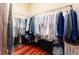 Walk-in closet with organized storage solutions for clothing, shoes, and accessories at 15944 Ternglade Dr, Lithia, FL 33547