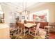 Open-concept dining room showcases hardwood floors and flows into the kitchen and entryway at 15944 Ternglade Dr, Lithia, FL 33547