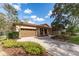 Beautiful single-story home featuring a two-car garage and a lush, landscaped yard at 15944 Ternglade Dr, Lithia, FL 33547