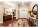 Elegant foyer with hardwood floors, stylish furnishings, and a view of the adjacent living spaces at 15944 Ternglade Dr, Lithia, FL 33547