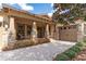 Inviting front exterior showcasing a charming porch with stone accents and a beautiful brick driveway at 15944 Ternglade Dr, Lithia, FL 33547