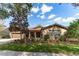 Charming single-story home with a well-manicured lawn and inviting landscaping at 15944 Ternglade Dr, Lithia, FL 33547