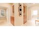 Hallway featuring custom built-in cabinets and display shelving at 15944 Ternglade Dr, Lithia, FL 33547