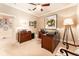 Spacious home office with built-in desk and ample natural light from a window at 15944 Ternglade Dr, Lithia, FL 33547