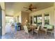 Relaxing screened patio with stylish seating and dining areas, offering a great space for entertaining at 15944 Ternglade Dr, Lithia, FL 33547