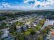 An aerial shot of a neighborhood showcases the community's layout and access to green spaces and waterfront views at 1609 Shady Oaks Dr, Oldsmar, FL 34677