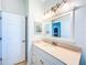 Bathroom with vanity, large mirror and good lighting fixtures at 1609 Shady Oaks Dr, Oldsmar, FL 34677