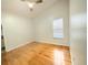 Bright bedroom with hardwood floors, ceiling fan, and a window at 1609 Shady Oaks Dr, Oldsmar, FL 34677
