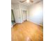 Bedroom with hardwood floors and a closet at 1609 Shady Oaks Dr, Oldsmar, FL 34677