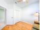 Bright bedroom with hardwood floors, closet and a ceiling fan at 1609 Shady Oaks Dr, Oldsmar, FL 34677