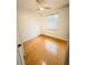 Bedroom with hardwood floors, natural light, and a ceiling fan at 1609 Shady Oaks Dr, Oldsmar, FL 34677